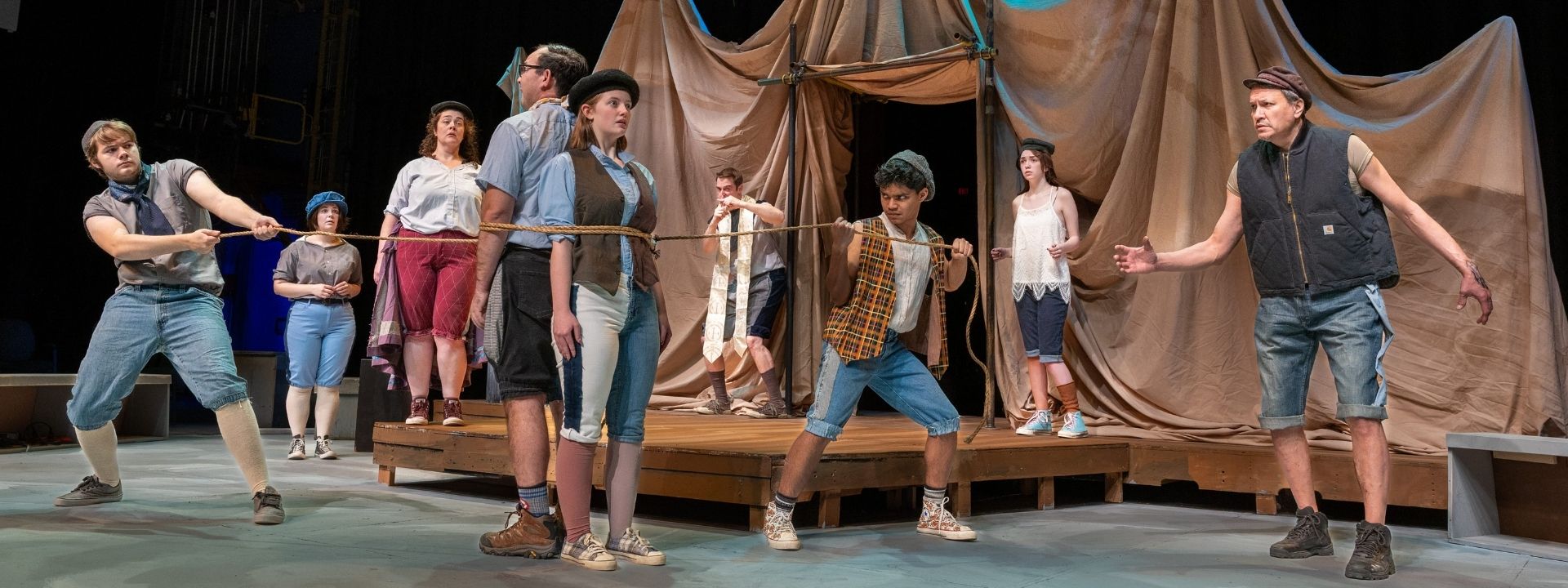 Dr. Pinch ties up Antipholus of Ephesus and Dromio of Ephesus” (Left-right): Logan Ehrhart, Kaylee Cole, Rachel Blackwell, Matthew Herrera, Emily Cooley, Levi Ben-Israel, Tim Hall, Daisy Massey and Don Crowe. From “Comedy of Errors” UAF Photo by Kade Mendelowitz