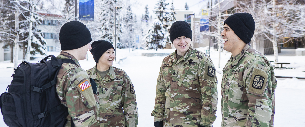 UAF ROTC students gather outside UAF Wood Center during the winter