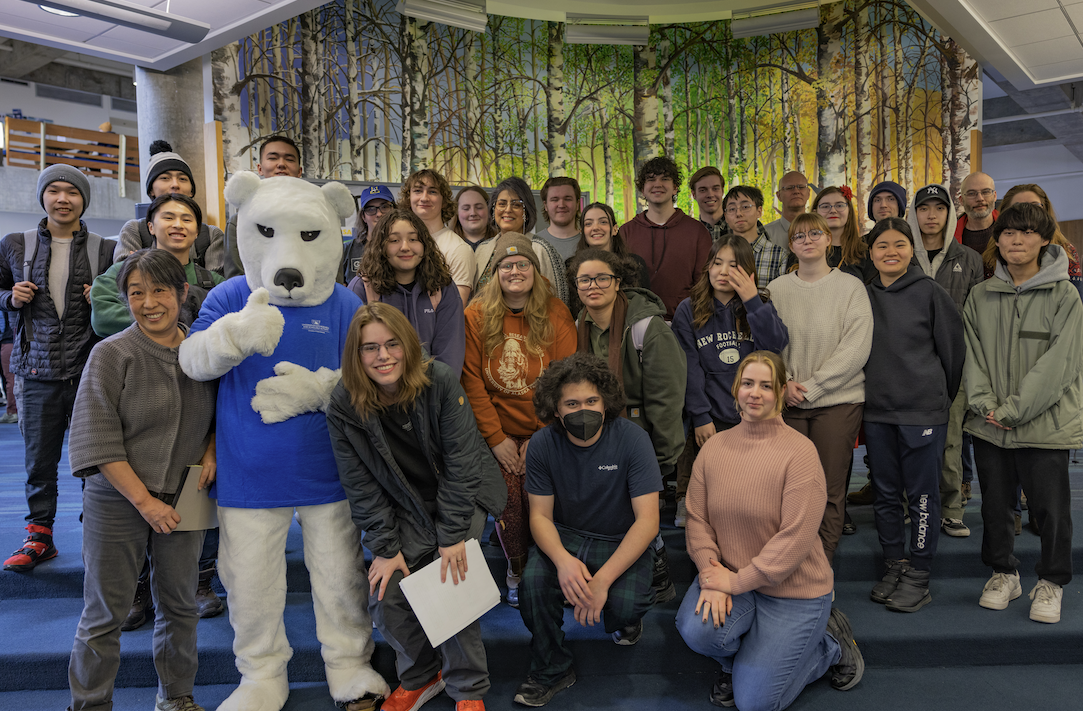 Group of UAF students with mentors and Nook Bear