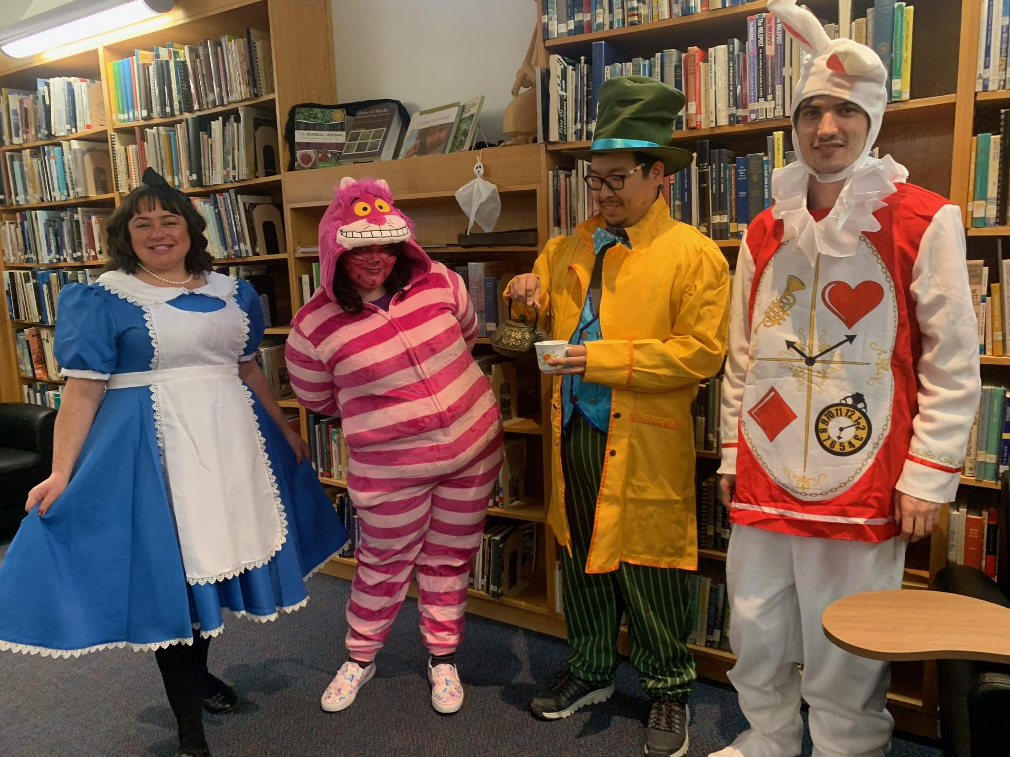 KCL Library staff photo dressed as characters from Alice in Wonderland