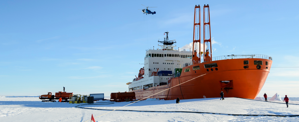 A giant Artic ship stopping by the icy shores to be re-fueled