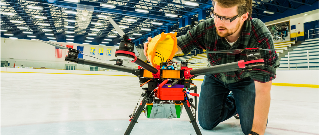 UAF Student assembling a drone