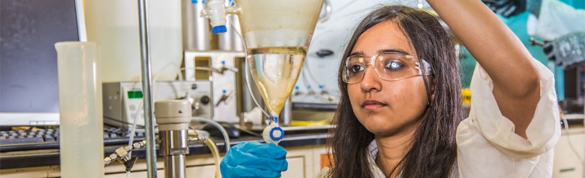 Graduate student Shruti Oza sets up apparatus for a procedure in UAF's Petroleum Development Lab in the Duckering Building