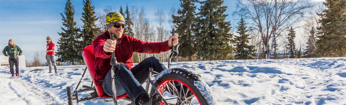 A UAF mechanical engineering student test drives a ski bike
