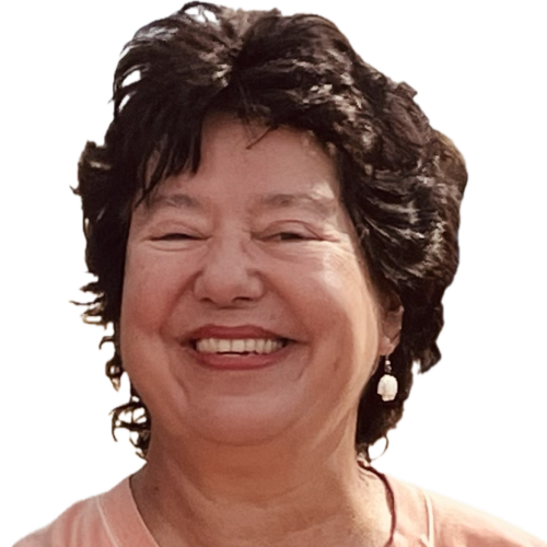 Woman with short, dark, curly hair smiling