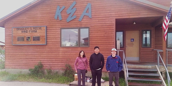 Joy Lomelino, RJ Michael and Solomon Himelbloom pose for a photo in front of the KEA building