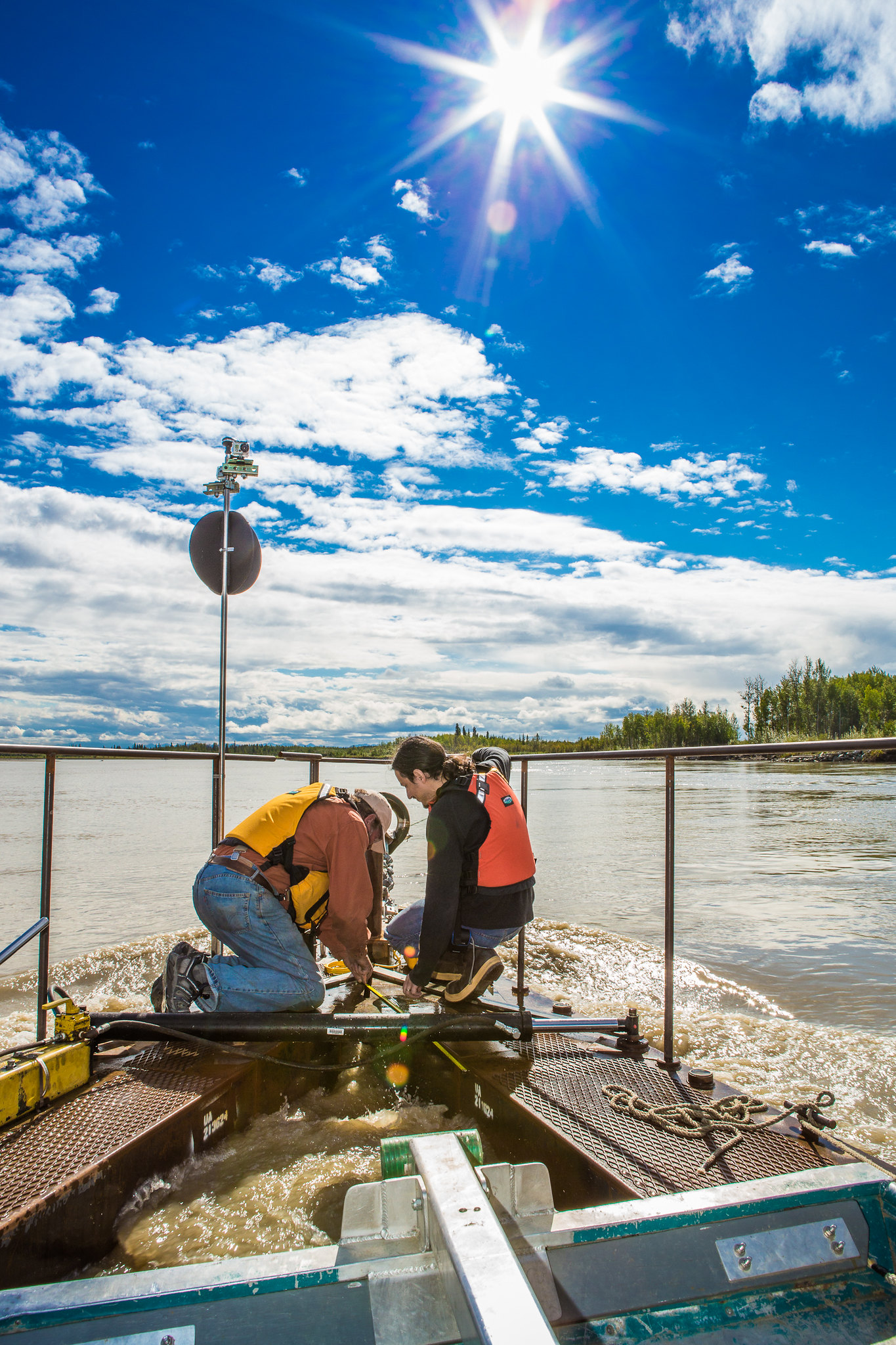 ACEP’s marine energy team works at the Tanana River Hydrokinetic Test Site