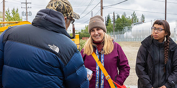 Gwen Holdmann, center, speaks to Billy Lee, president of the Shungnak tribal government, during a visit to the Alaska community as part of the Arctic Remote Energy Networks Academy. At right is Tashonia Martin of Galena. Photo by Amanda Byrd/ACEP.