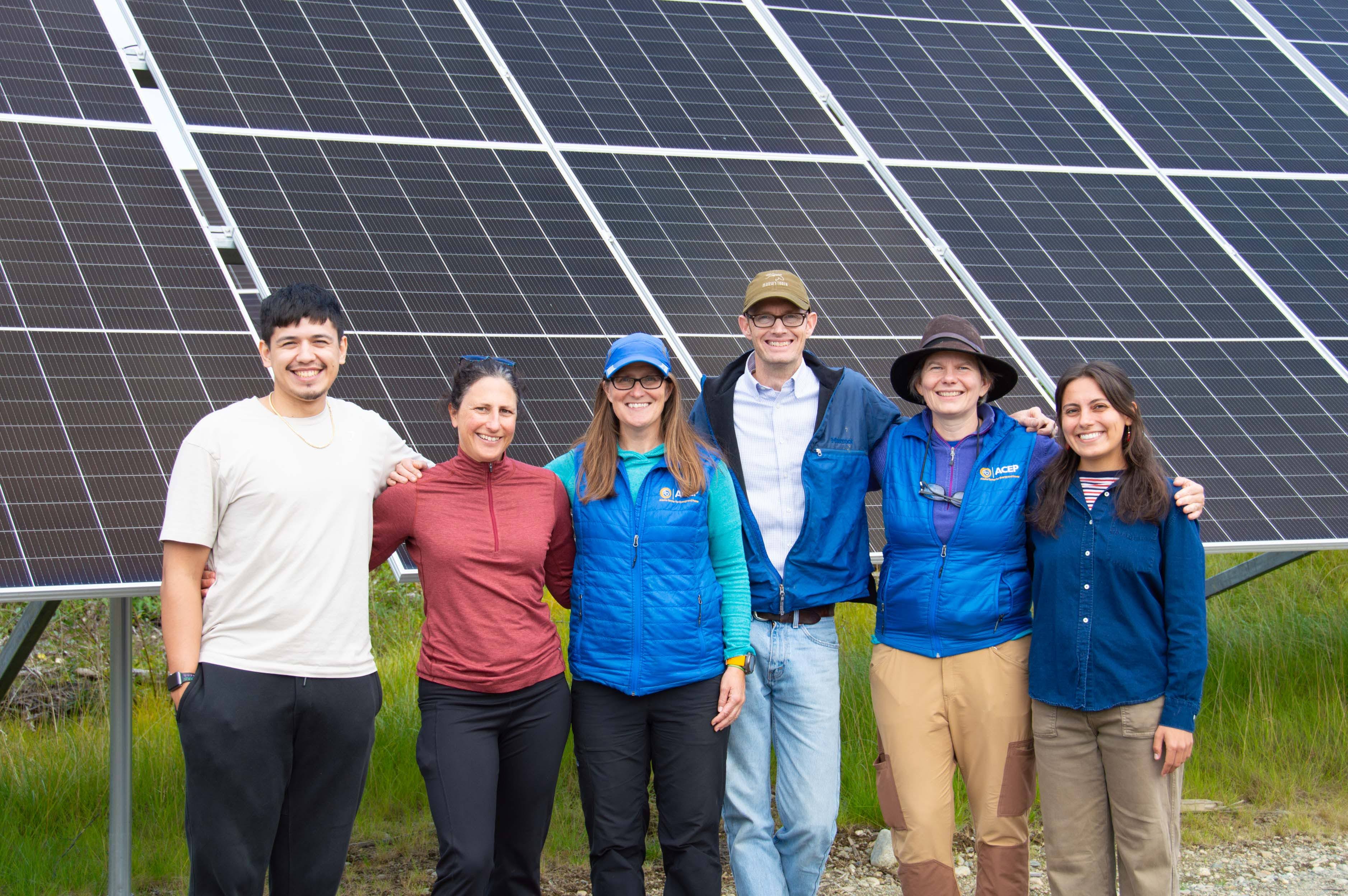 ACEP members in front of a solar array