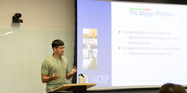 RJ Michael gives a presentation of his work. Photo by Yuri Bult-Ito/ACEP.