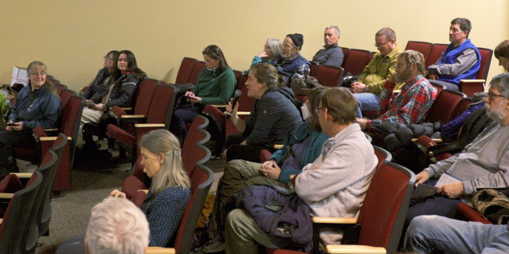 An audience member asks a question