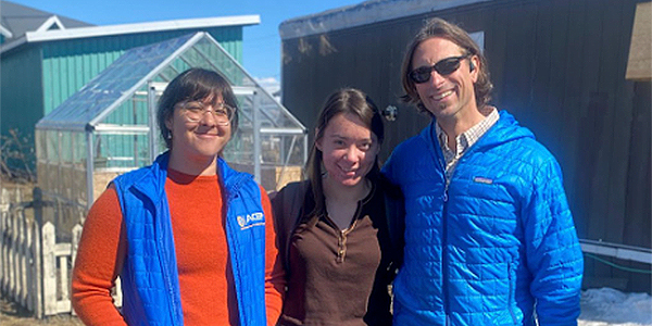 ACEP team members Alana Vilagi (left), Rachel Curtis (middle), George Reising (right) pose for a photo outside a home in Kotzebue where T3 students practiced collecting energy audit measurements. Photo by Haruko Wainwright