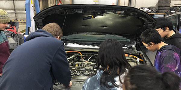 GILA Students check out a plug-in electric hybrid vehicle in Galena. Photo by Michelle Wilber/ACEP.