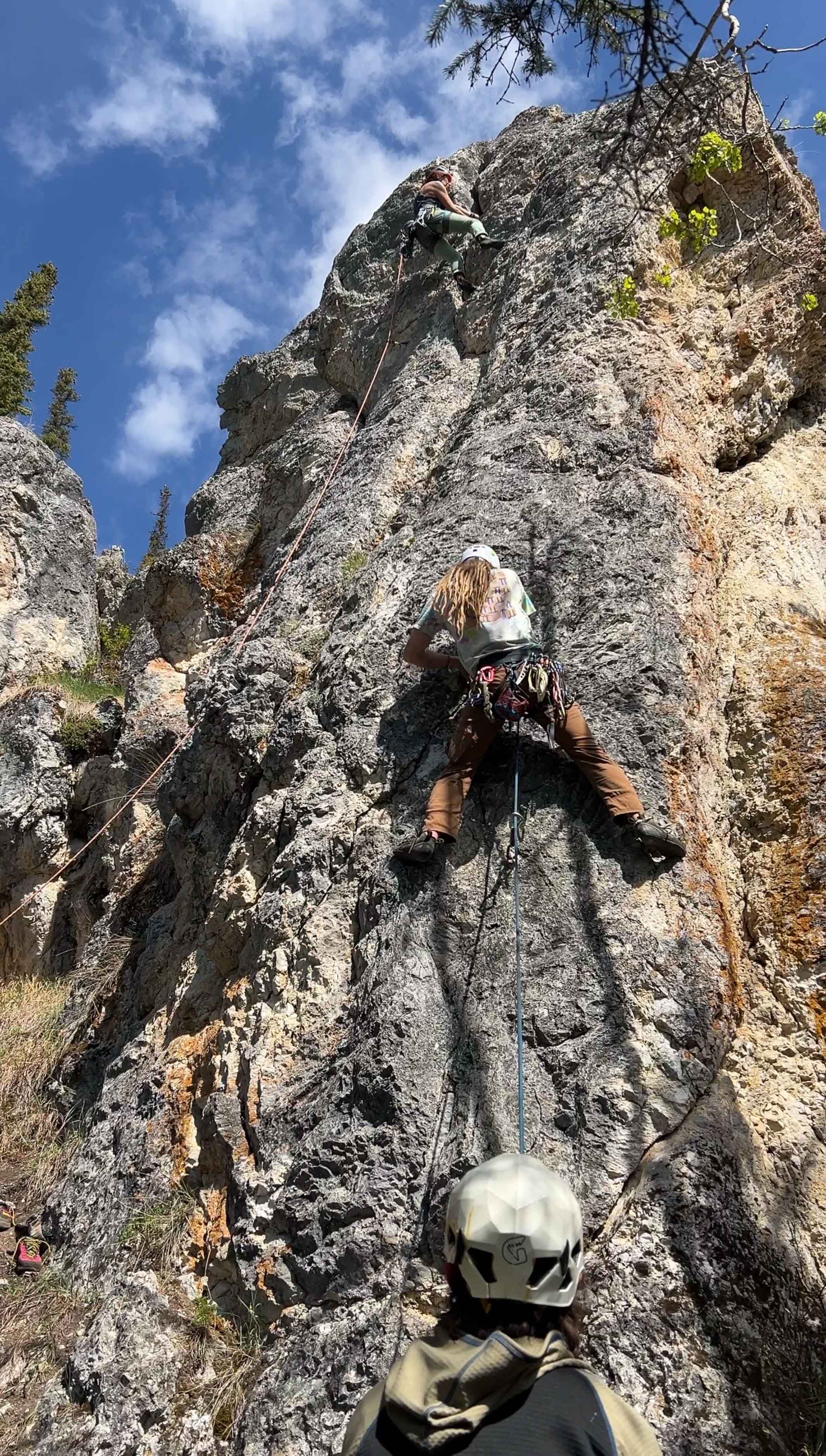 Glen Woodworth climbs a rock.