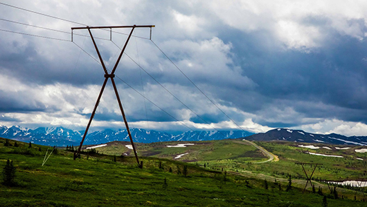 Power pole utility on an Alaska mountain range.