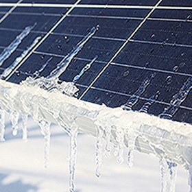 Solar panel with ice and snow on it