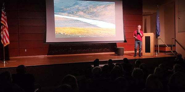 Seth Kantner presented photos and stories from his life living among the caribou along the Kobuk River and surrounding areas to a standing room only audience at the Morris Thompson Cultural and Visitor Center. Photo by Amanda Byrd.