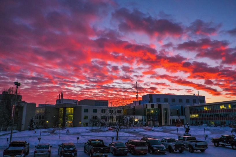 Pink cloudy winter sunrise over Fairbanks campus
