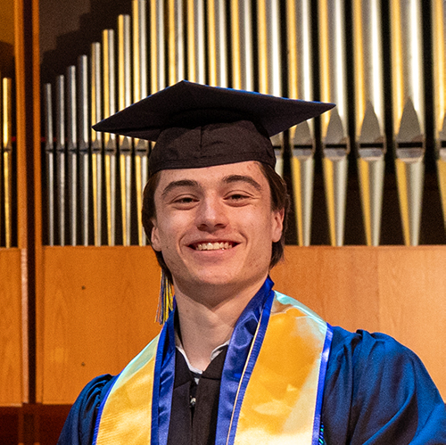 Photo of Nolan Earnest in his cap and gown during Commencement