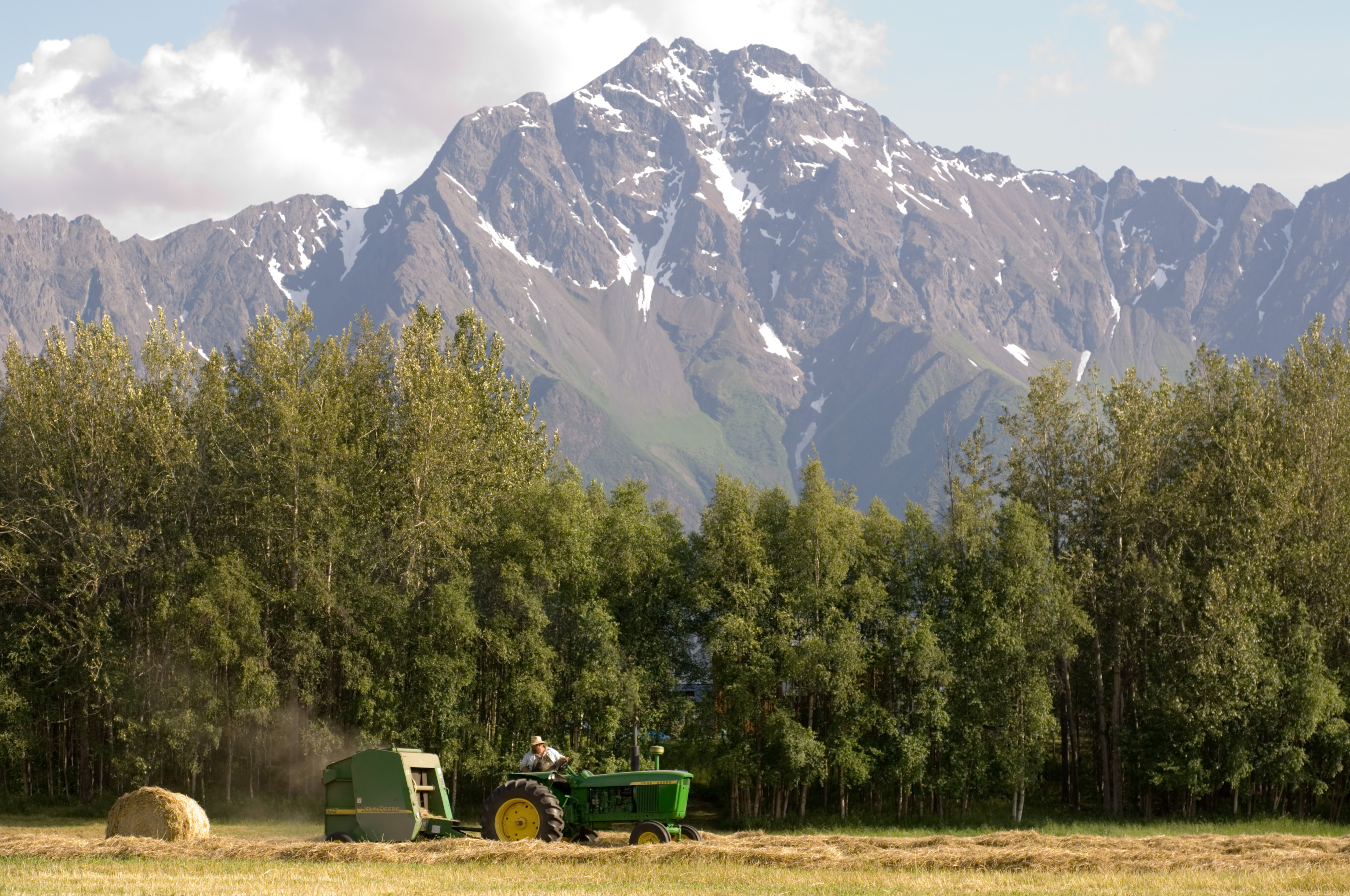 Tractor in front of a mountain