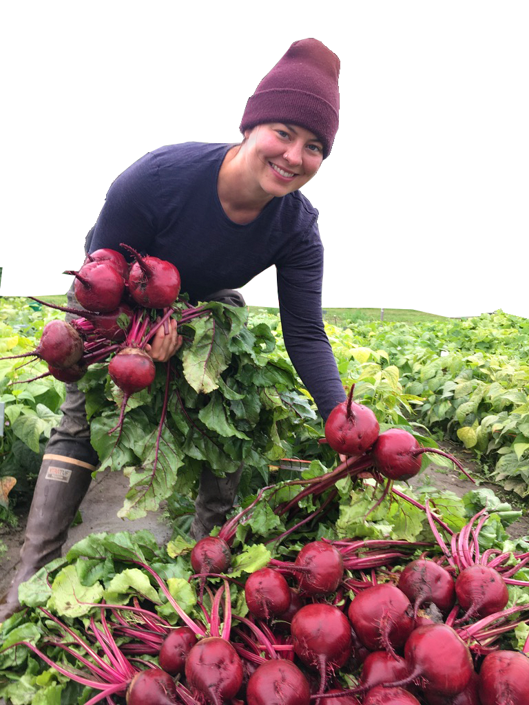 Woman standing over beets