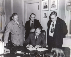 Signing the agreement to establish the Alaska cooperative unit.