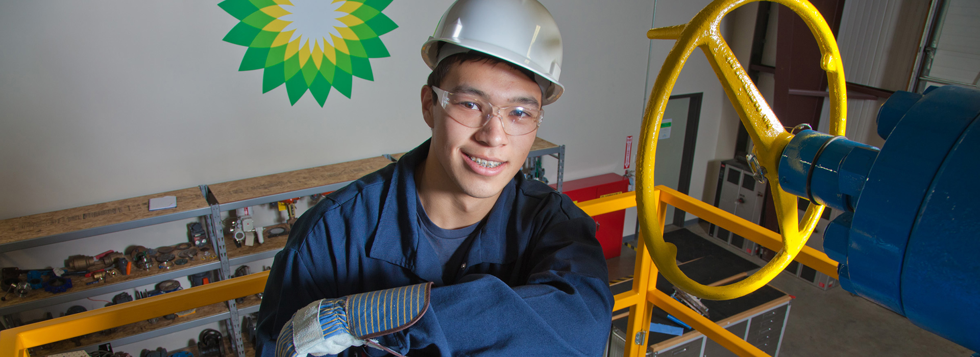 Petroleum Engineering and Process Technology major, Stefan Weingarth, opens a valve on the oil field well head at CTC&#39;s process technology facility on Van Horn Road. The working well head was part of a donation worth almost $4 million made by BP. Credit: UAF Photo by Todd Paris