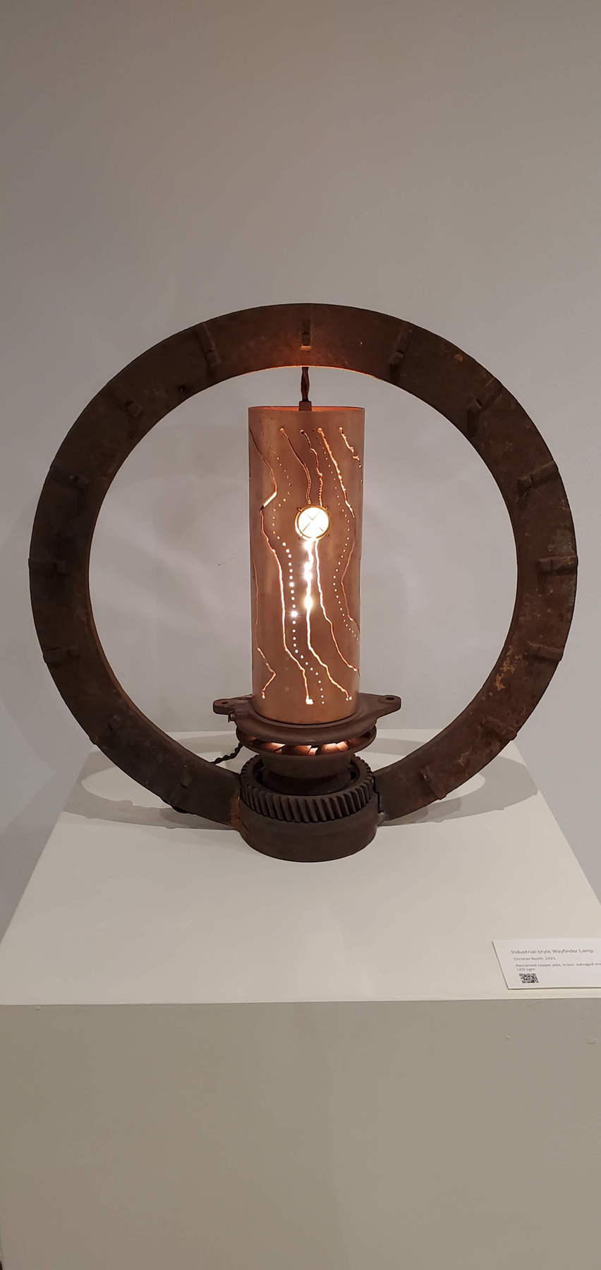 An industrial-style lamp with elements that suggest navigation., image courtesy of the artist