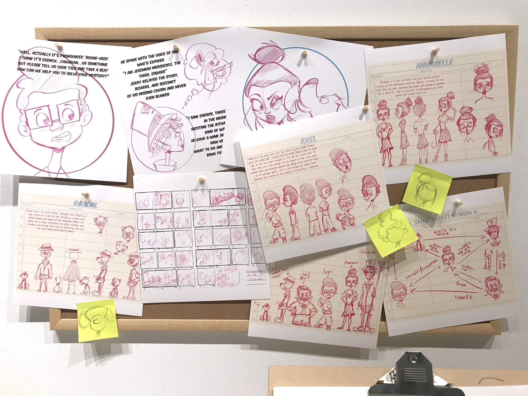 Storyboards and sketches hang on a corkboard during David Glover's thesis exhibition, image courtesy of the artist