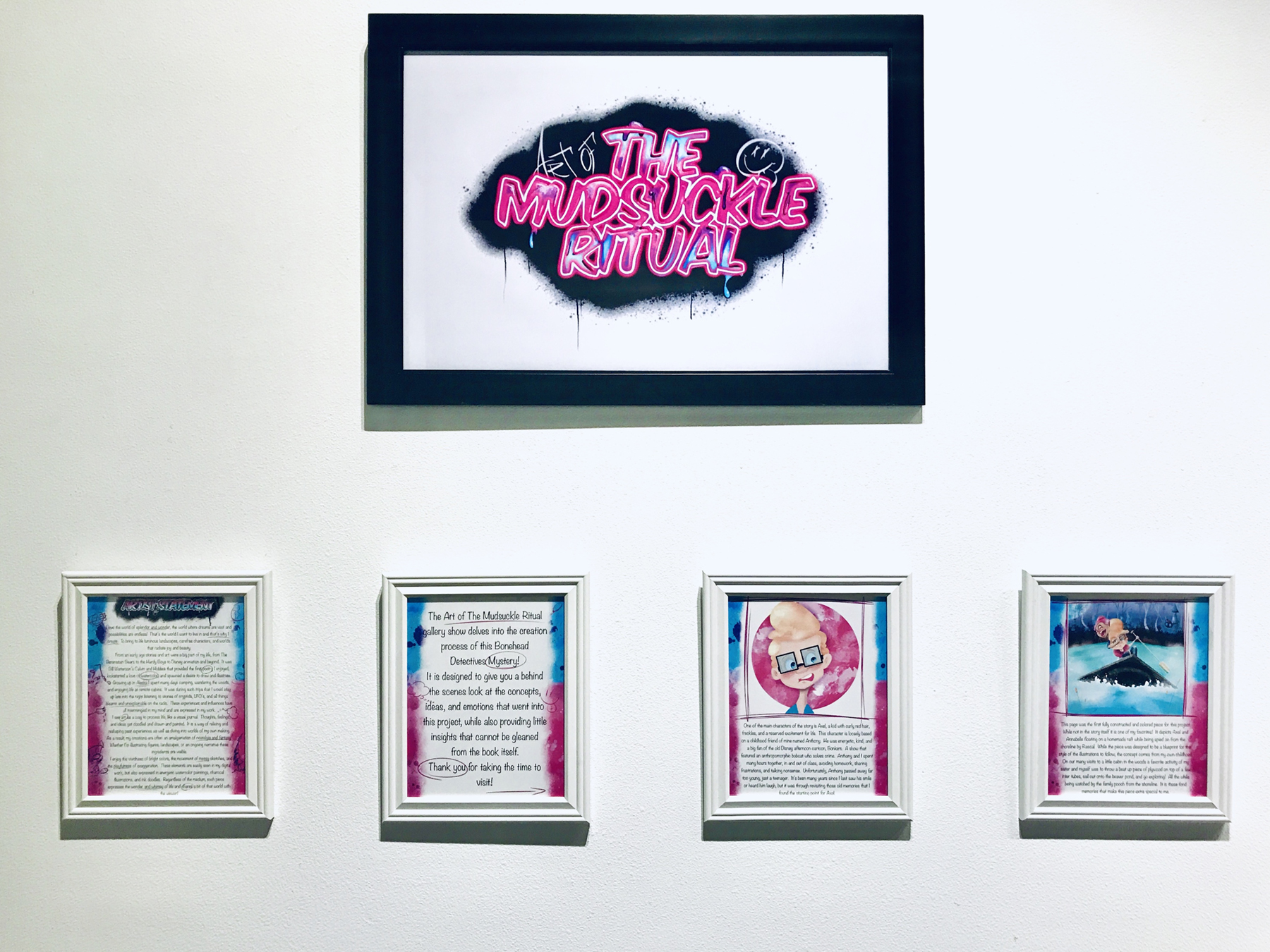 Show title and digital prints hang on the wall during David Glover's thesis show, Art of the Mudsuckle Ritual, image courtesy of the artist
