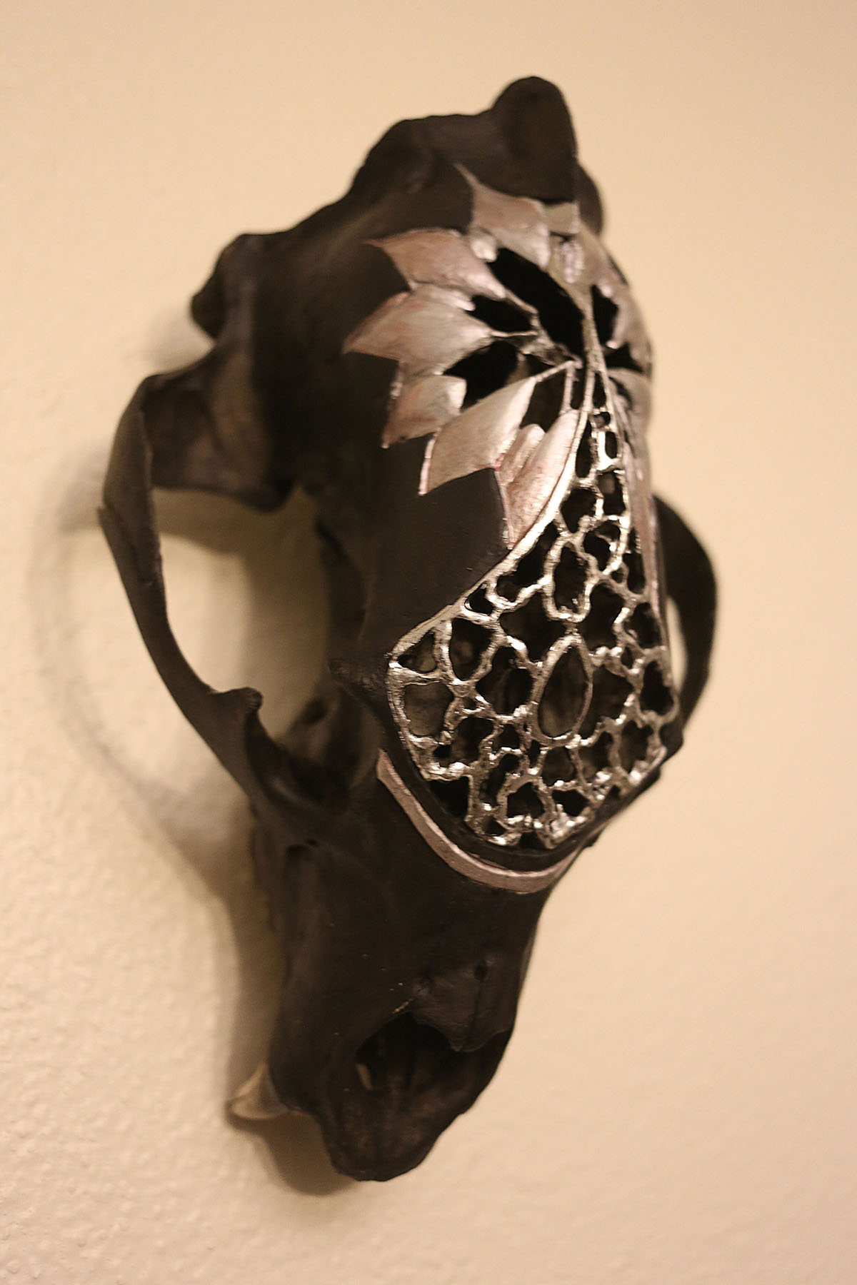 Carved bear skull painted with black and silver acrylic paint. Image courtesy of Indi Walter