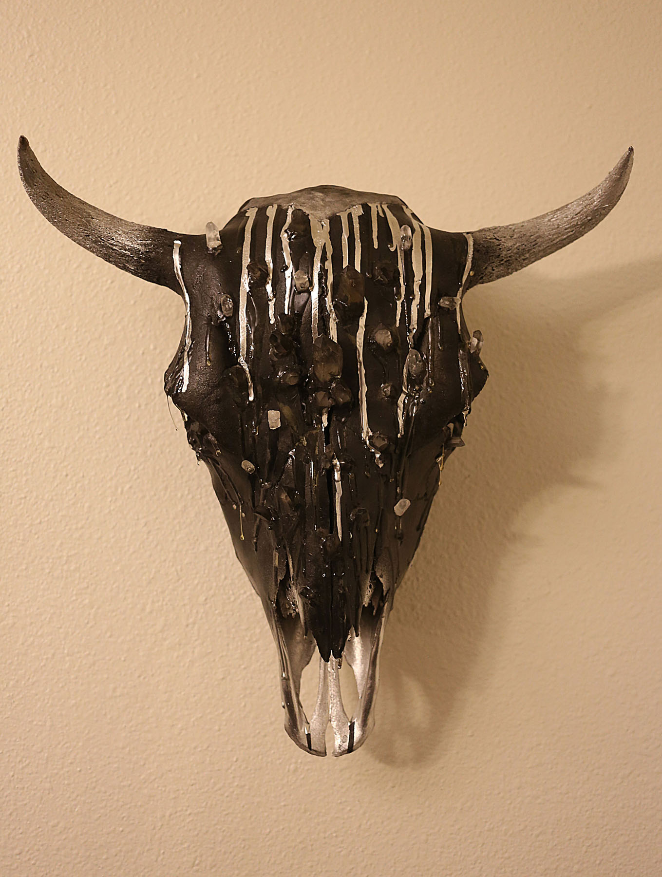 black bison skull adorned with quartz crystals. image courtesy of Indi Walter