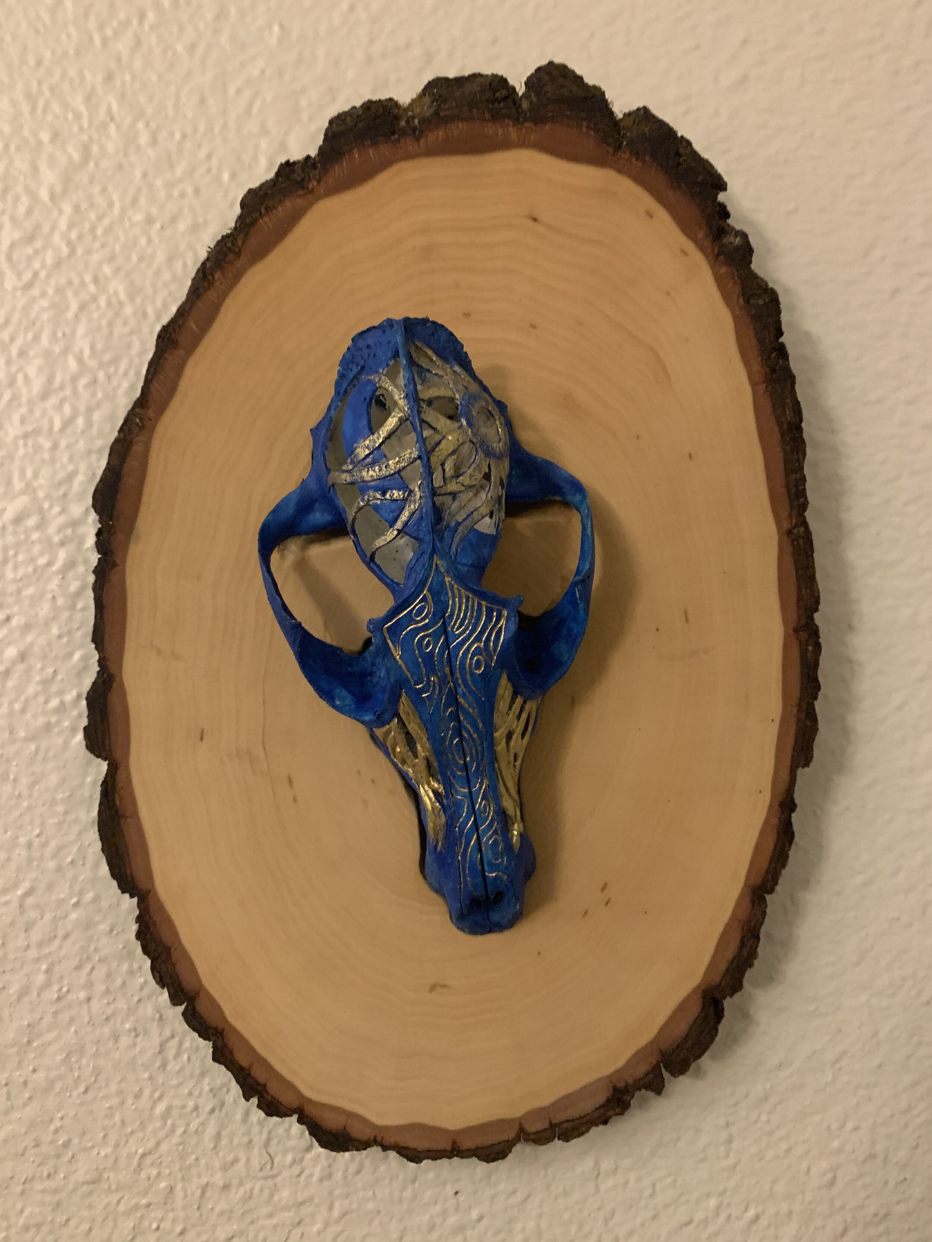 Natural fox skull affixed to basswood and colored with acrylic paint and alcohol ink. Image courtesy of Indi Walter