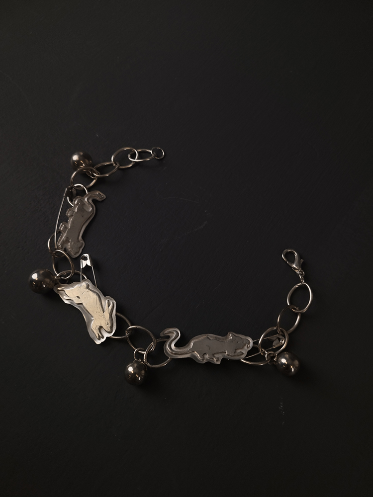 A bracelet made from silver bunnies and safety pins. Image courtesy of the artist