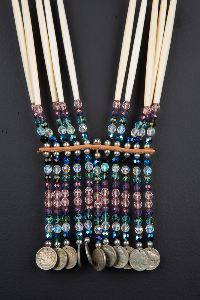 Intricately beaded necklace with Buffalo coins hand-sewn by Michelle Bailey. Image courtesy of the artist