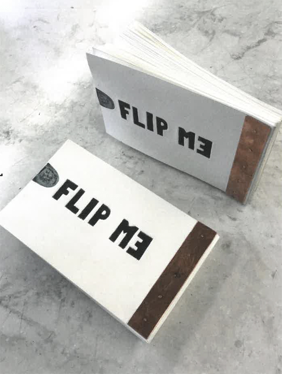 Two small flip books that read "Flip Me" on the cover where the "E" in "Me" is backwards. Image courtesy of Naomi Hutchquist