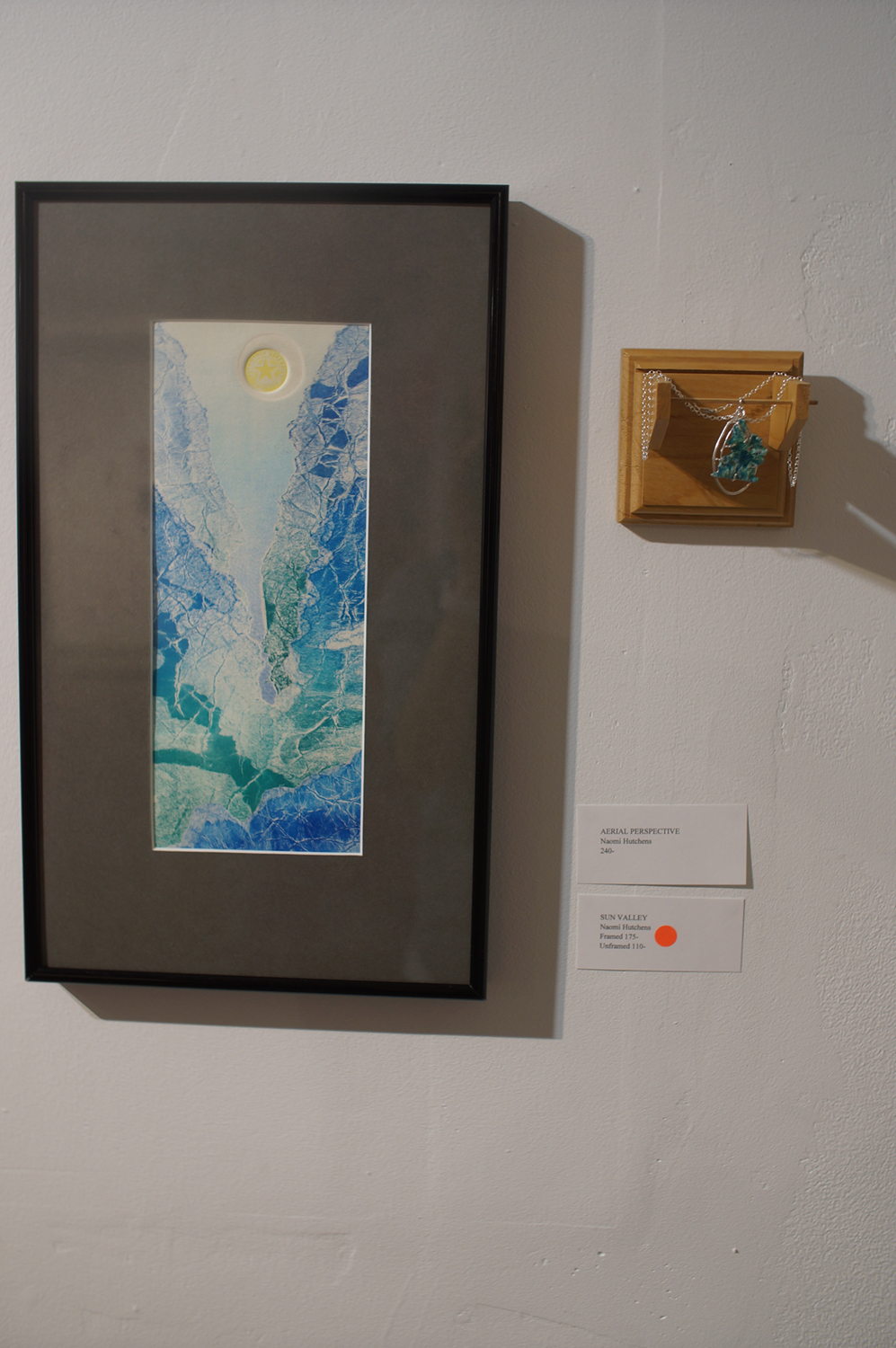 Sun Valley and Aerial Perspective hang on the wall at Naomi Hutchquist's BFA thesis exhibition at Well Sreet Art Gallery in 2019. Image courtesy of Naomi Hutchquist.