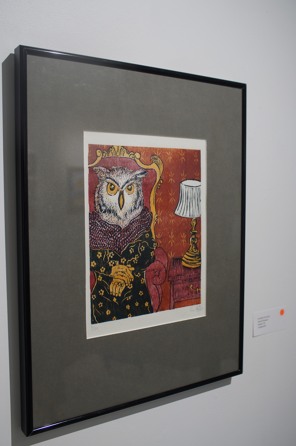 A print of an owl hangs on the wall at Naomi Hutchquist's BFA thesis exhibition at Well Sreet Art Gallery in 2019. Image courtesy of Naomi Hutchquist.
