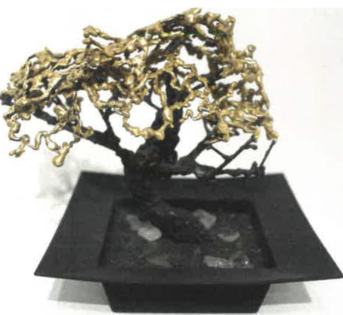 Sculpted bonsai tree with brass leaves. Image courtesy of Naomi Hutchquist