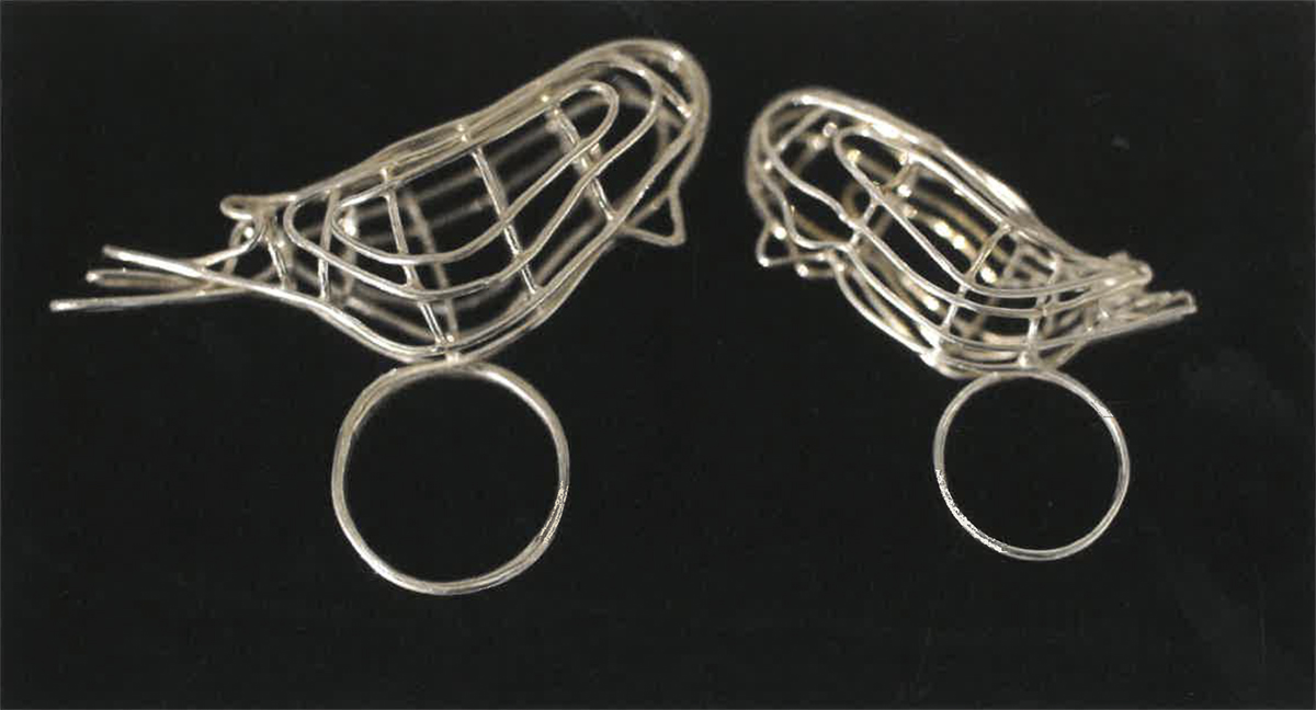Two silver rings with mesh bird adornments. Image courtesy of Naomi Hutchquist