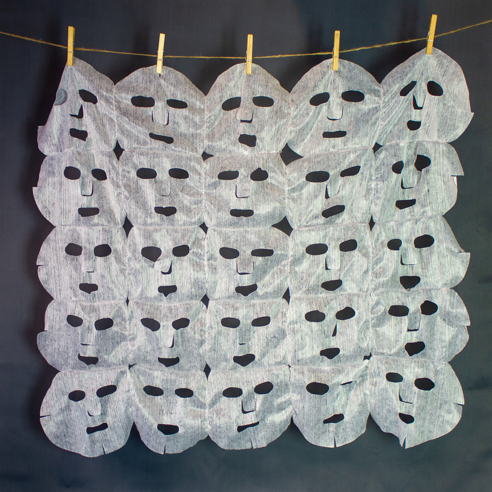 a grid of face mask sheet stitched together, courtesy of the artist