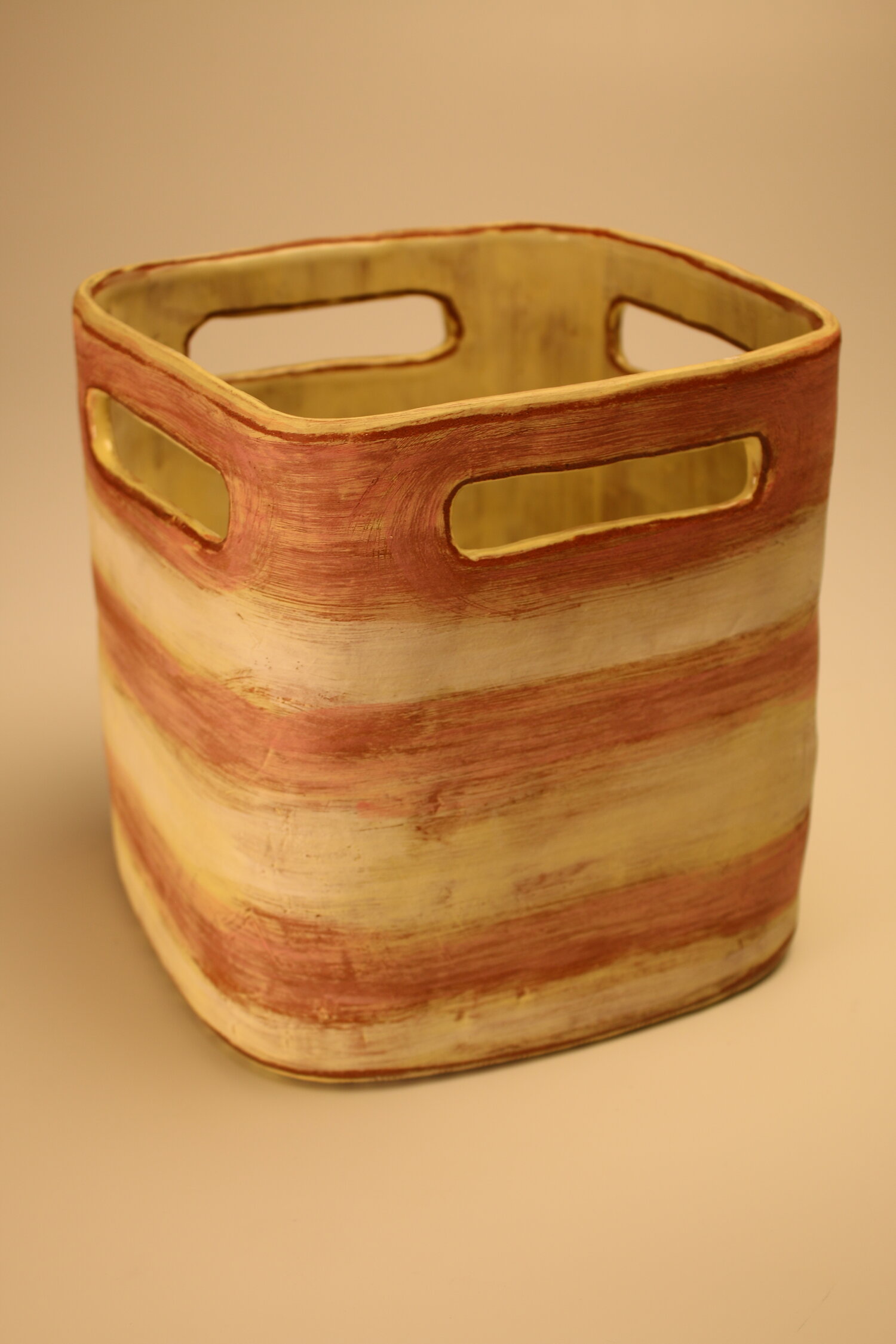 Square shaped yellow and brown deep ceramic bucket, image courtesy of the artist