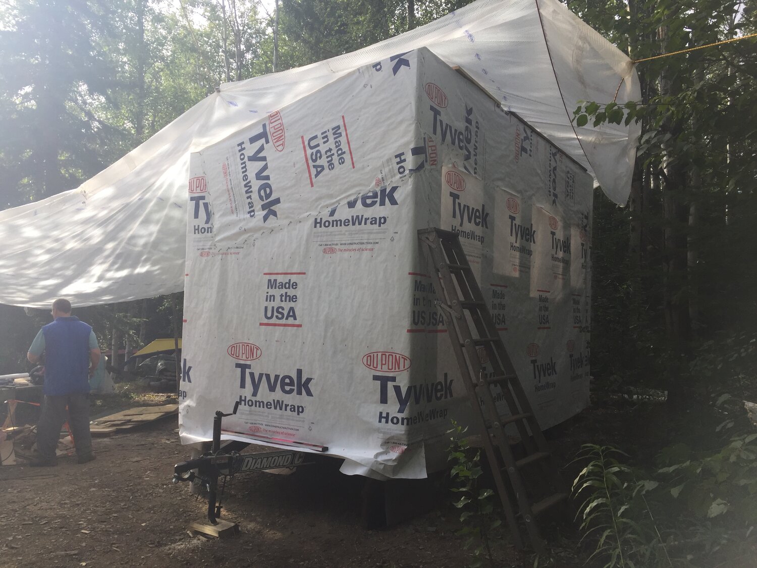 Tyvek covers the outside of the tiny gallery as it is protected under a tarp, image courtesy of the artist
