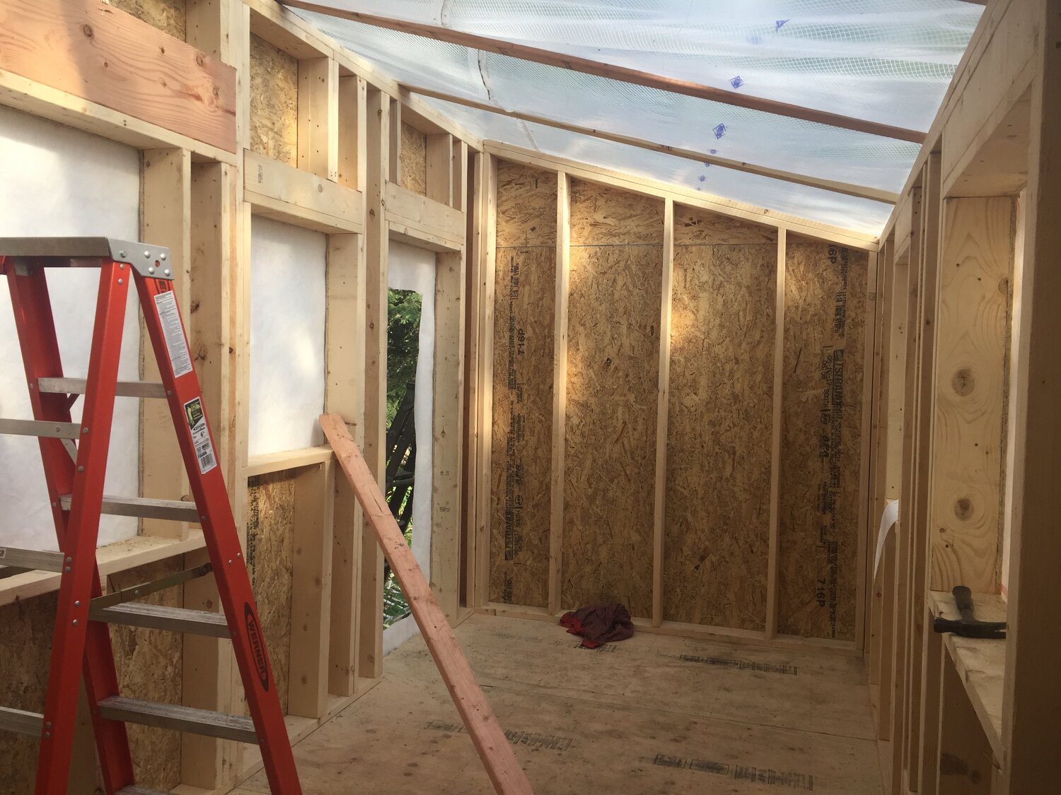 The interior of the tiny gallery is prepared for insulation and wiring, image courtesy of the artist