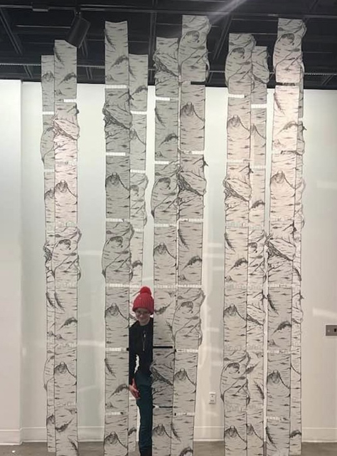 Installation image of hanging paper birch trees during Susan Andrews' MFA exhibition The Cascade Effect. Image courtesy of the artist