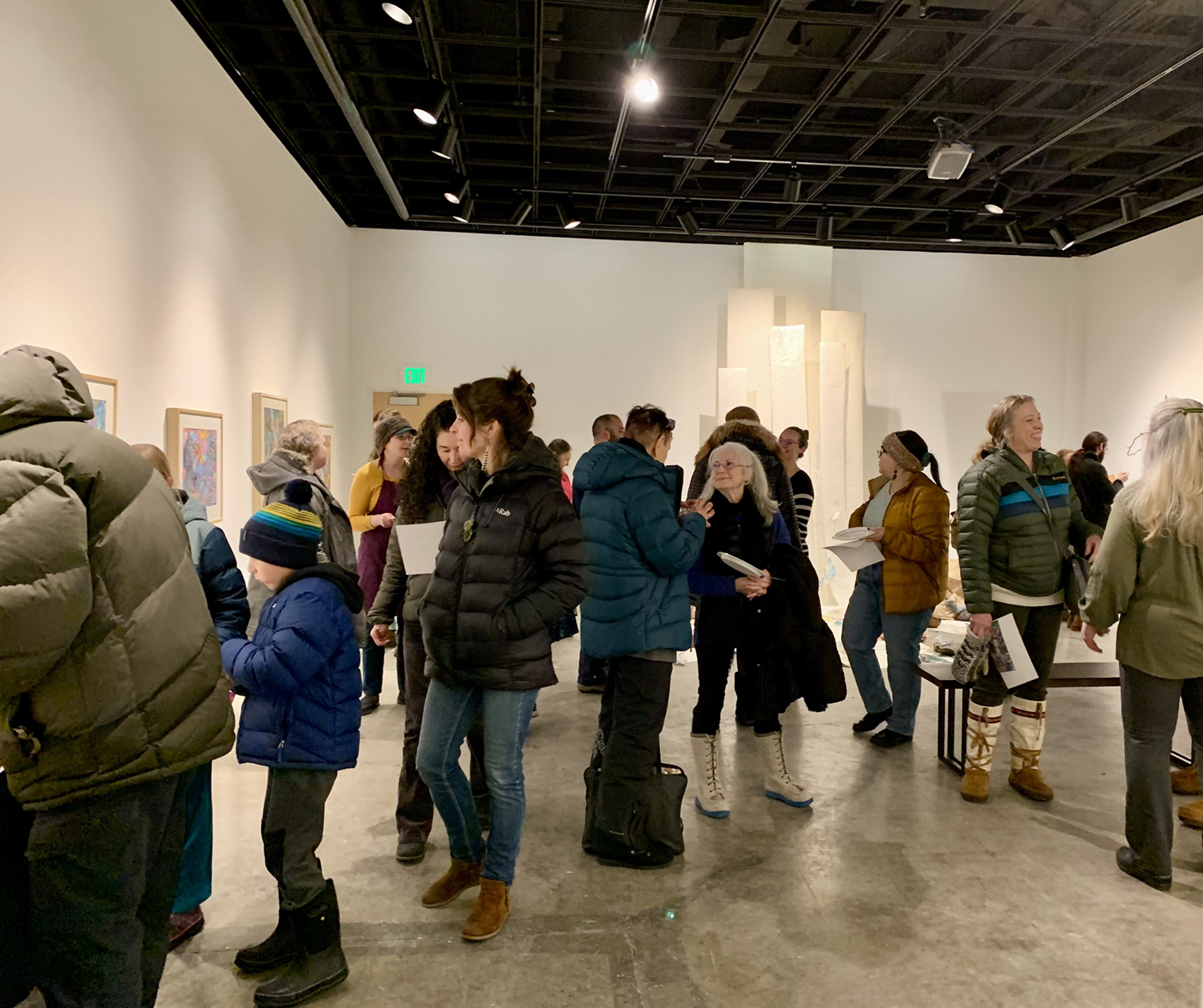 A crowd during the reception of Susan Andrews' MFA exhibition The Cascade Effect in the UAF Art Gallery. Image courtesy of the artist