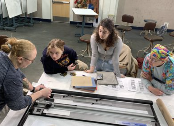 Allison Juneau running a framing and matting workshop/demo for UAF students in 2023. UAF Photo courtesy of the Department of Art 