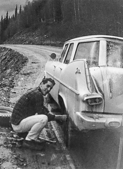 Straub changes a tire near Circle Hot Springs in 1966, a task he recommends everyone learn to do before it’s needed. Photo courtesy of Alan Straub.