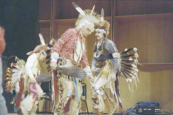 Dancers in ceremonial feather regalia perform at an early Festival of Native Arts. Alaska and Polar Regions Collections, Elmer E. Rasmuson Library, University of Alaska Fairbanks.