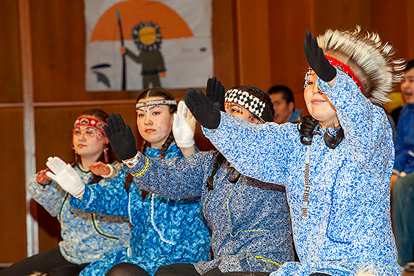 Performers dressed in traditional clothing, including fur headpieces and intricate beadwork, participate in a dance at the 2009 Festival of Native Arts. UAF photo by Todd Paris.